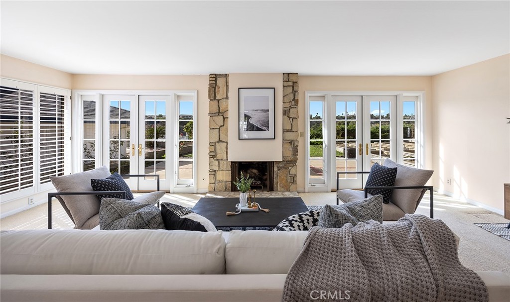 215 Via Montego San Clemente, CA 92672 - Photo 22 of 69 a living room with furniture large window and fireplace