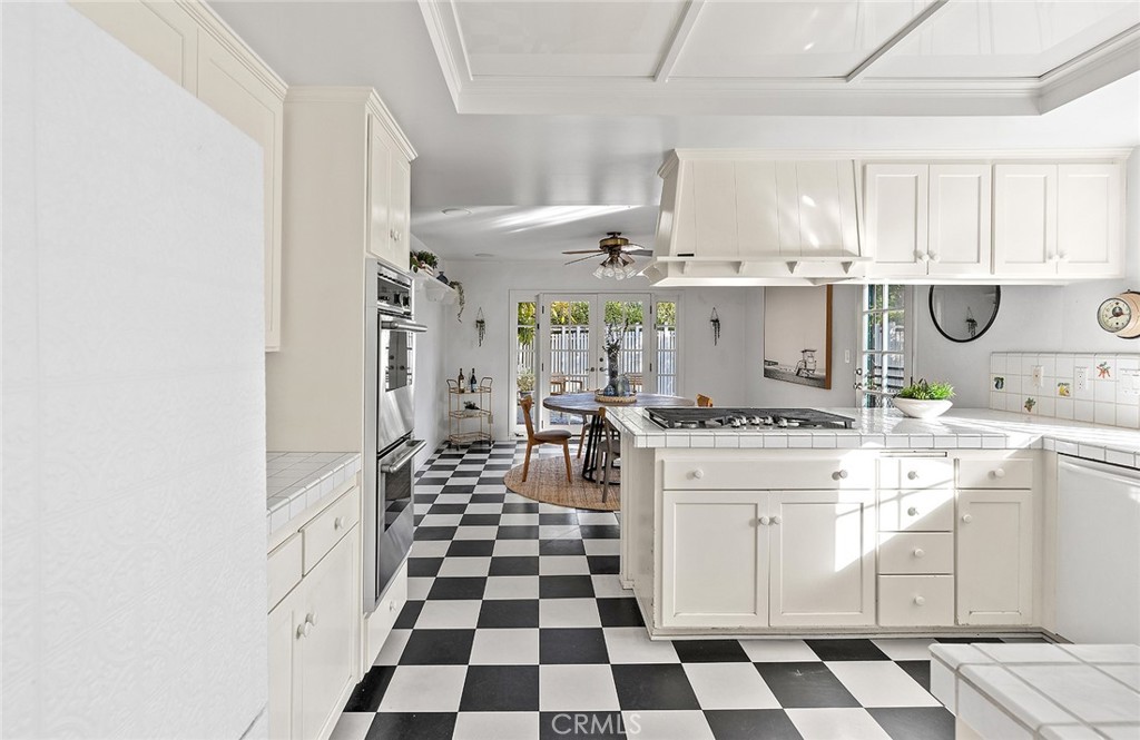 215 Via Montego San Clemente, CA 92672 - Photo 26 of 69 a kitchen with a stove a sink and a refrigerator