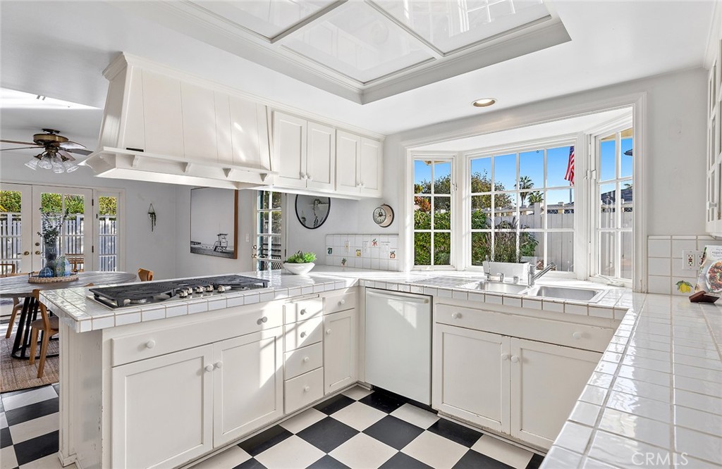 215 Via Montego San Clemente, CA 92672 - Photo 27 of 69 a kitchen with a stove sink and cabinets