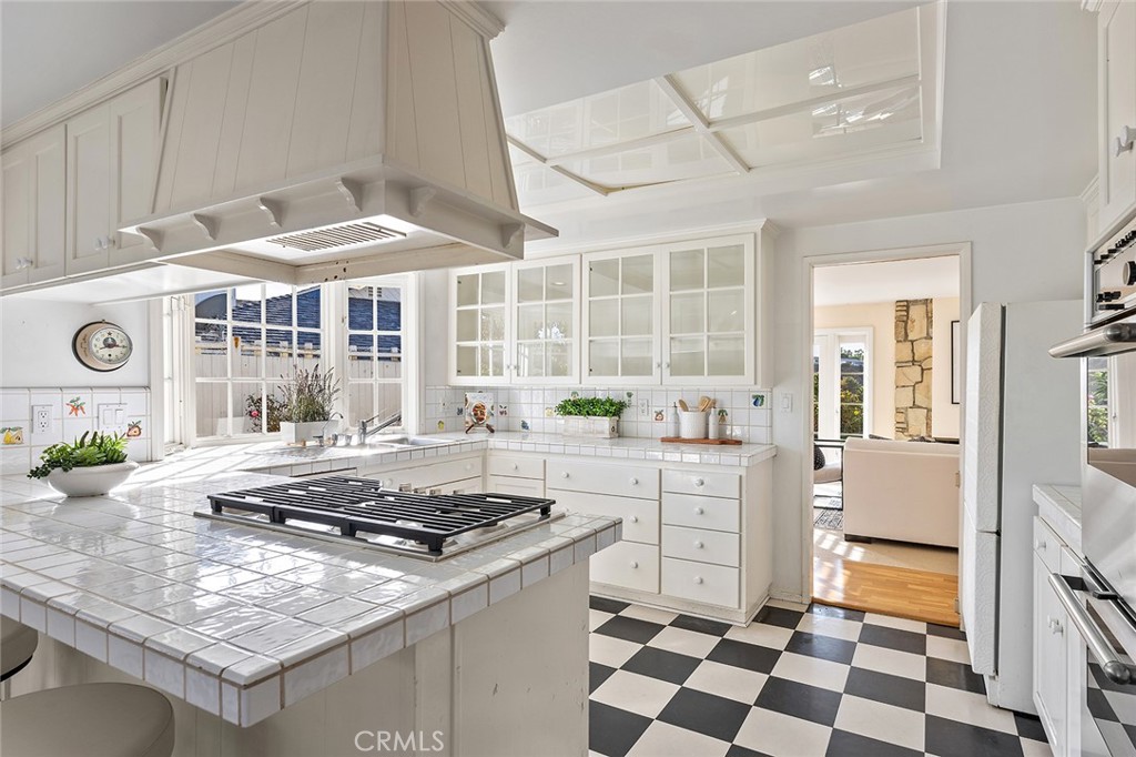 215 Via Montego San Clemente, CA 92672 - Photo 28 of 69 a kitchen with a stove a sink and a refrigerator