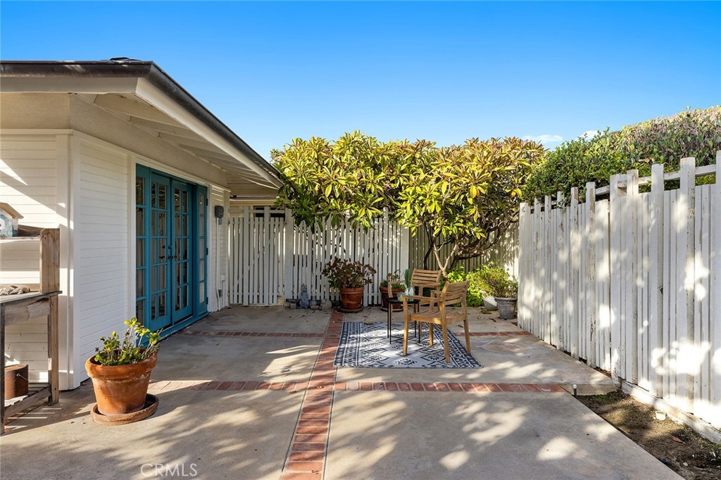 215 Via Montego San Clemente, CA 92672 - Photo 33 of 69 a view of a patio with table and chairs and potted plants