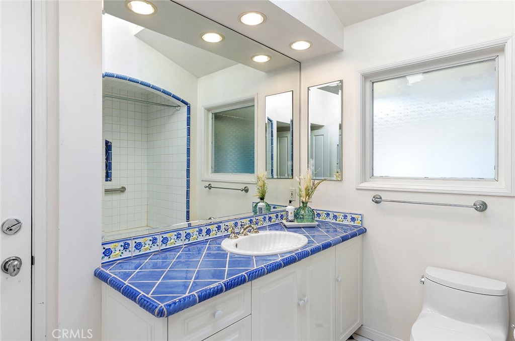 215 Via Montego San Clemente, CA 92672 - Photo 44 of 69 a bathroom with a sink and a mirror
