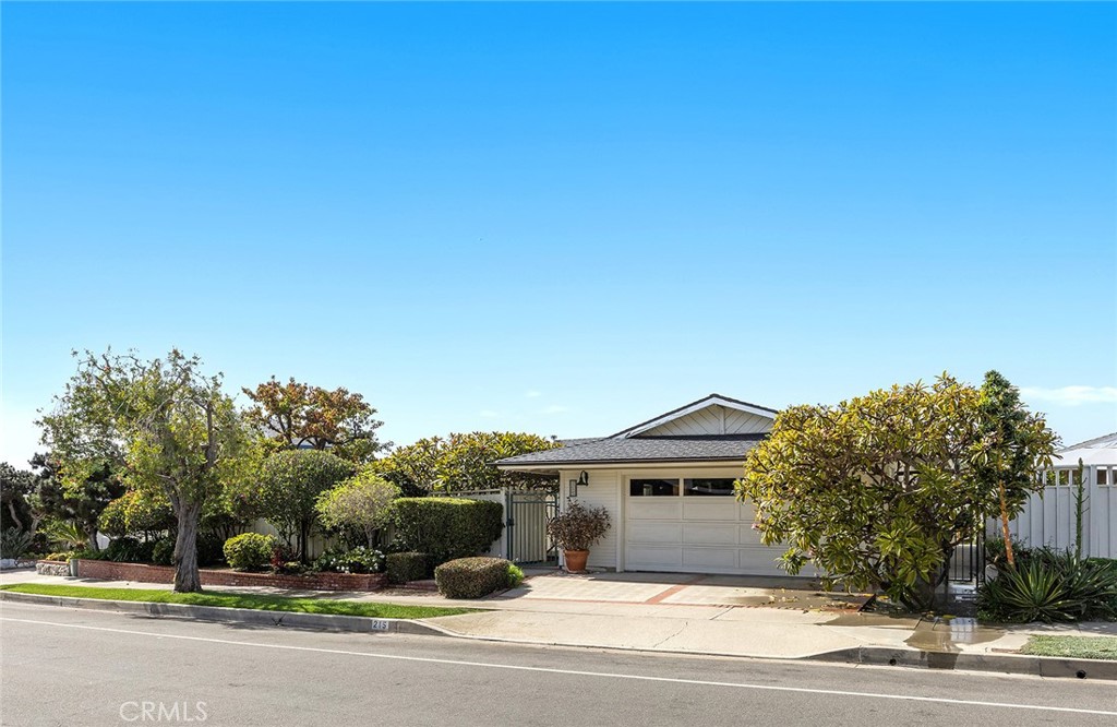 215 Via Montego San Clemente, CA 92672 - Photo 45 of 69 a front view of a house with a yard and garage