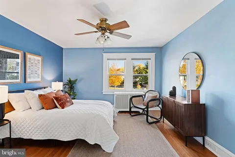 a bedroom with a bed and a chair