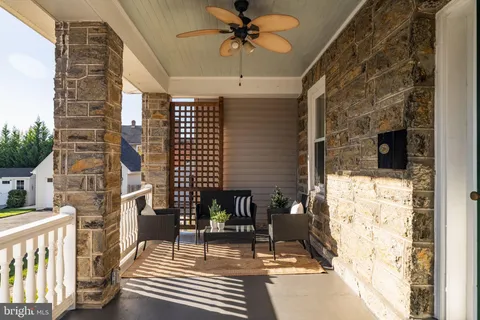 a view of a balcony with furniture