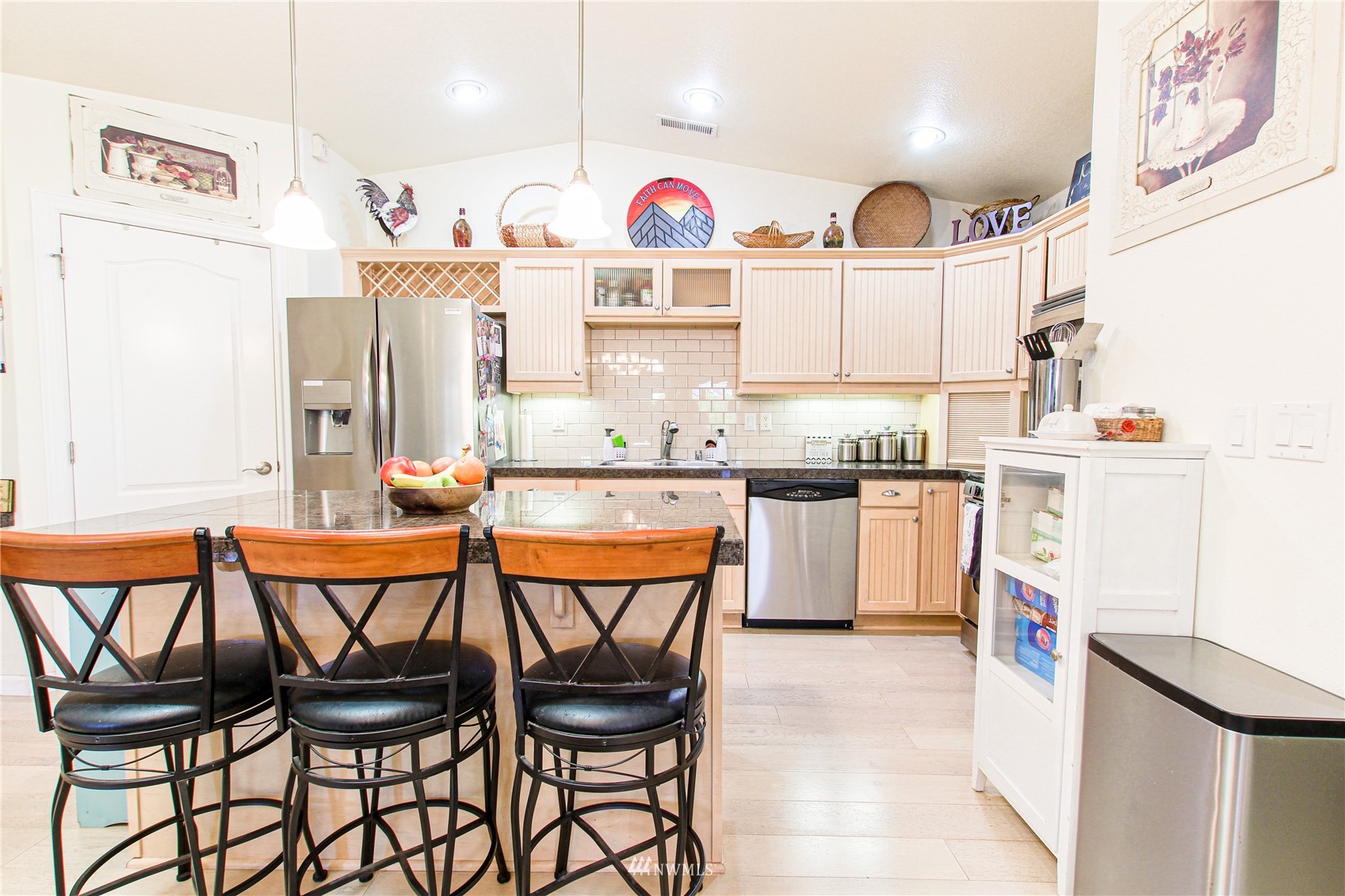 159 Willow Pointe Loop Longview, WA 98632 - Photo 20 of 34 a kitchen with stainless steel appliances a table and chairs in it