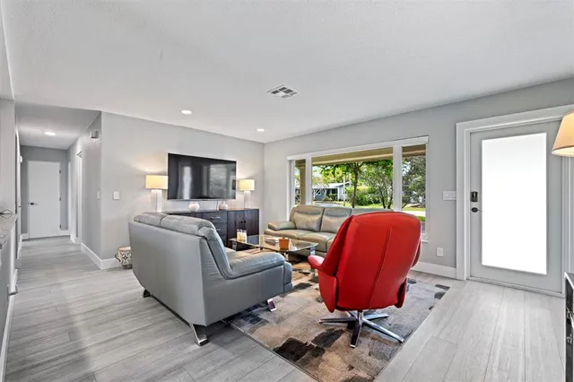 a living room with furniture or couch and a window