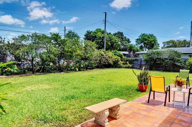 a view of a chairs and table in the garden