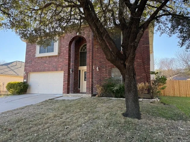 a view of a house with a tree and a tree