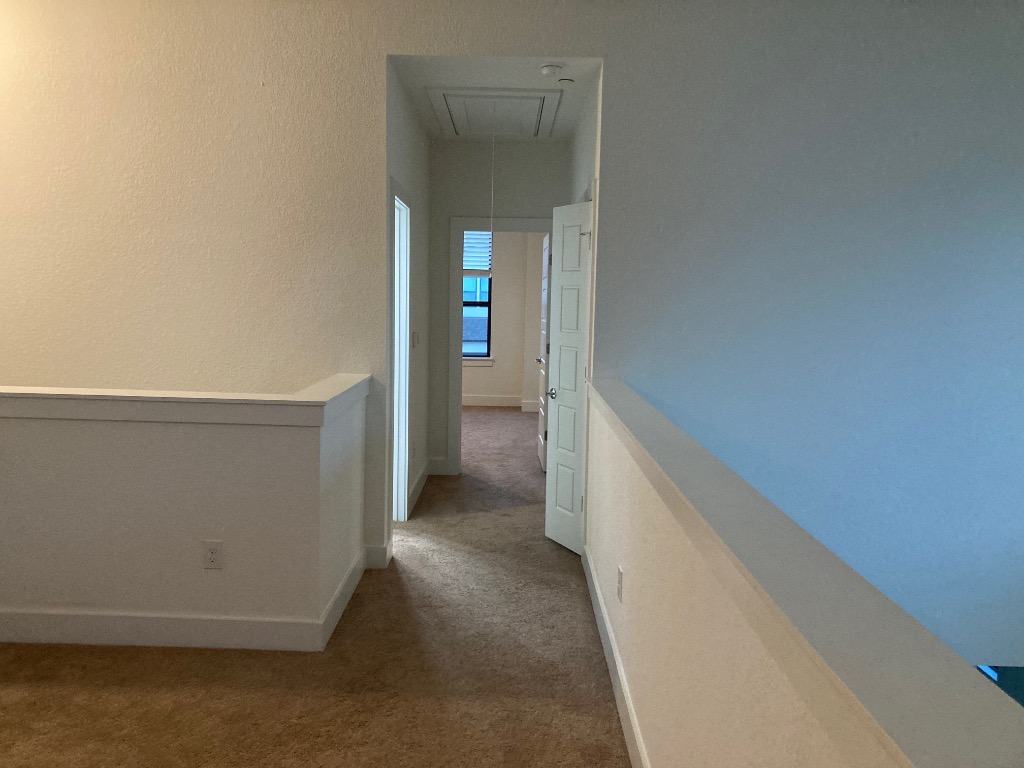 12410 Maypole Bend, Unit 1401 Austin, TX 78717 - Photo 23 of 32 a view of hallway with stairs