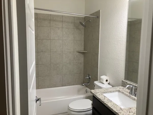 a view of a bathroom from a hallway