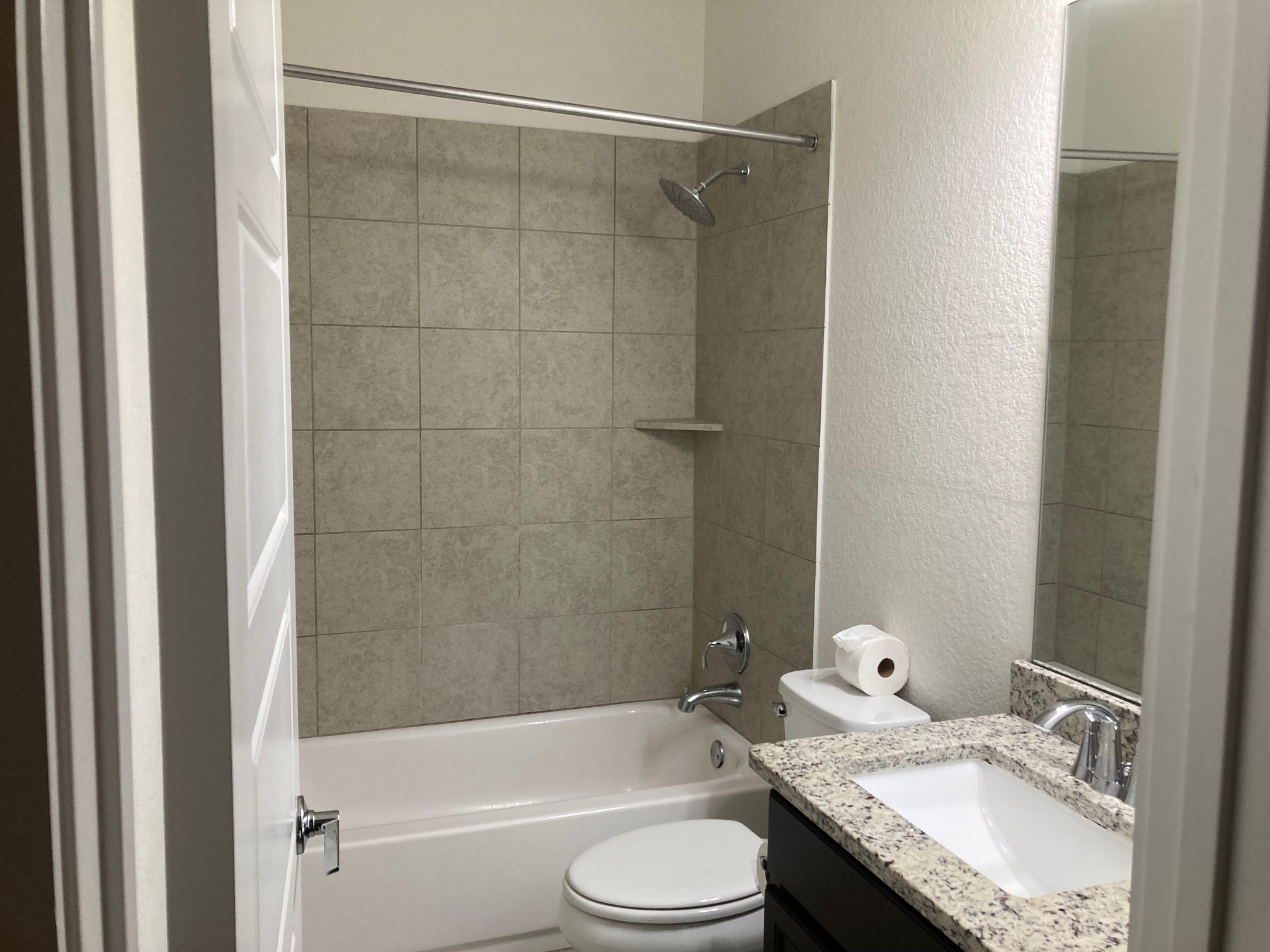 12410 Maypole Bend Austin, TX 78717 - Photo 27 of 32 a bathroom with a granite countertop bathtub shower sink vanity and toilet