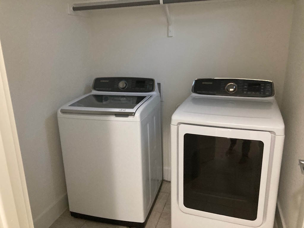 12410 Maypole Bend, Unit 1401 Austin, TX 78717 - Photo 31 of 32 a utility room with dryer and washer