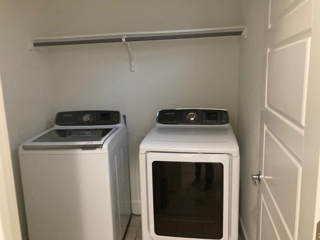 12410 Maypole Bend, Unit 1401 Austin, TX 78717 - Photo 32 of 32 a utility room with dryer and washer