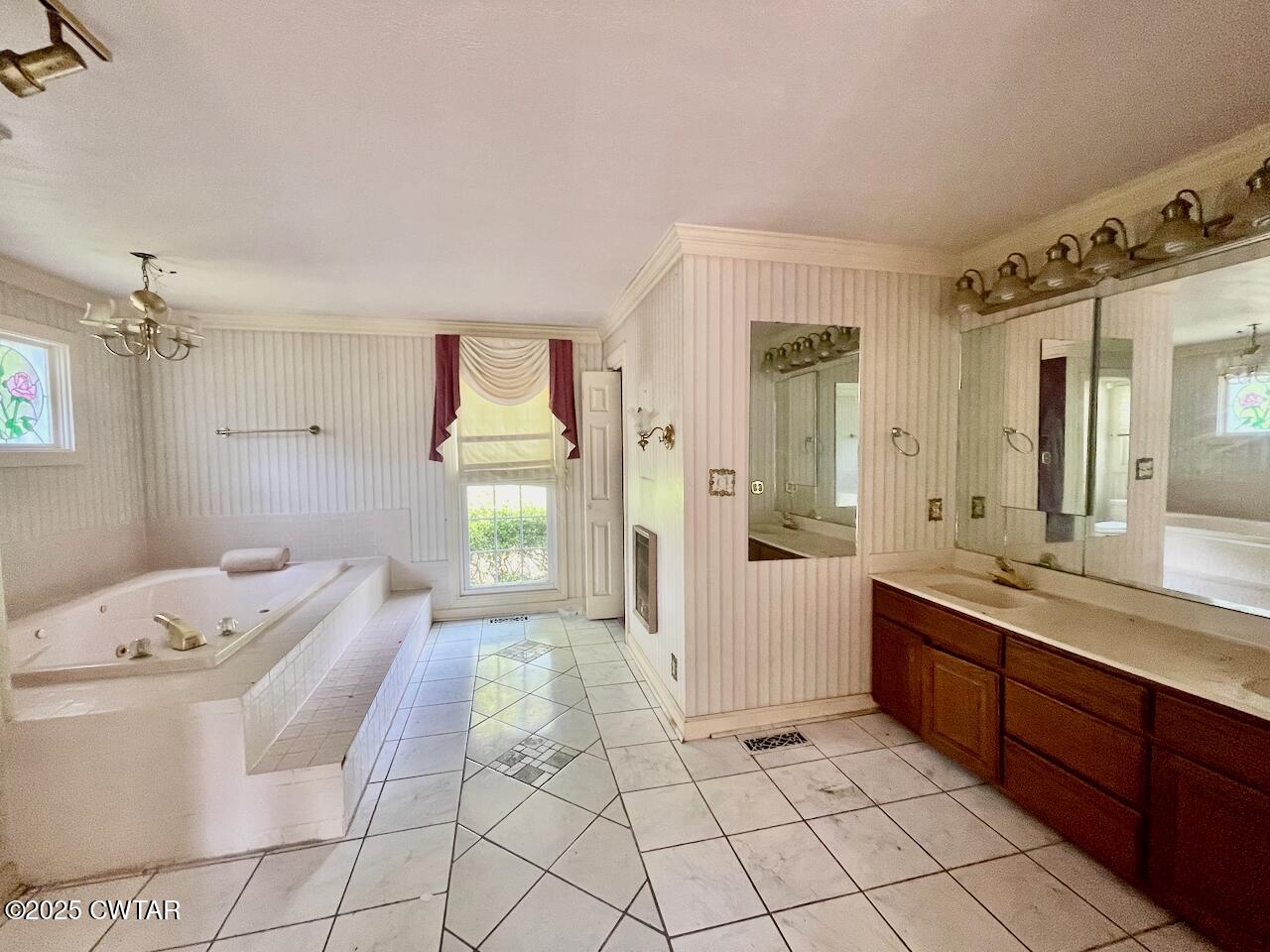 2688 Beech Bluff Road Jackson, TN 38301 - Photo 15 of 30 a spacious bathroom with a granite countertop sink and a mirror