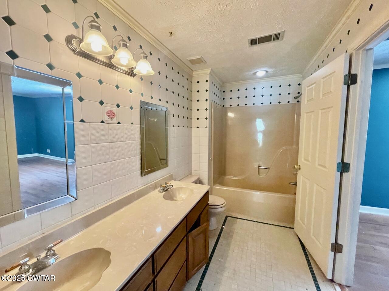 2688 Beech Bluff Road Jackson, TN 38301 - Photo 20 of 30 a spacious bathroom with a granite countertop sink mirror and shower