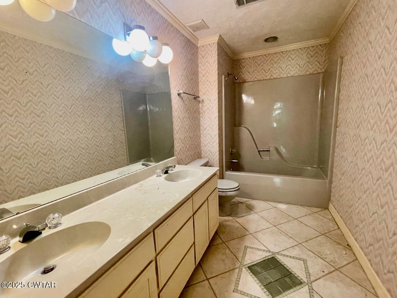 2688 Beech Bluff Road Jackson, TN 38301 - Photo 23 of 30 a bathroom with a tub sink and mirror