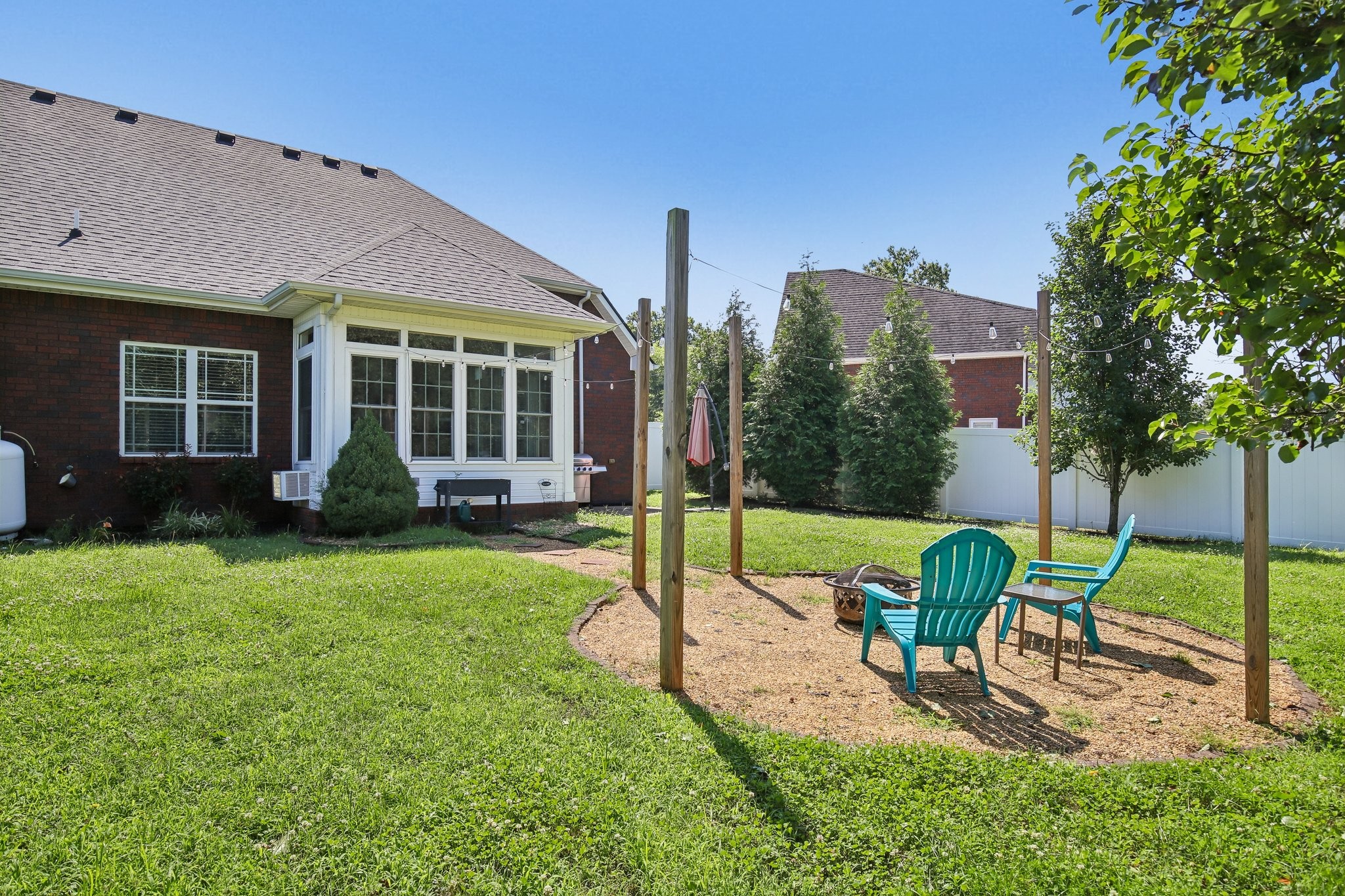 316 Amazonway Ridge Lascassas, TN 37085 - Photo 31 of 36 a view of a house with backyard sitting area and garden