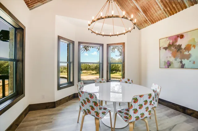 a view of a dining room with furniture window and outside view