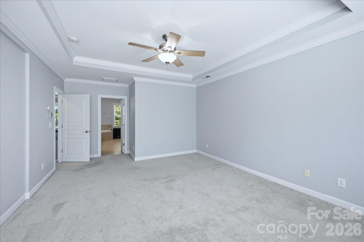 1825 Laveta Road Charlotte, NC 28269 - Photo 19 of 48 a view of an empty room with a chandelier fan