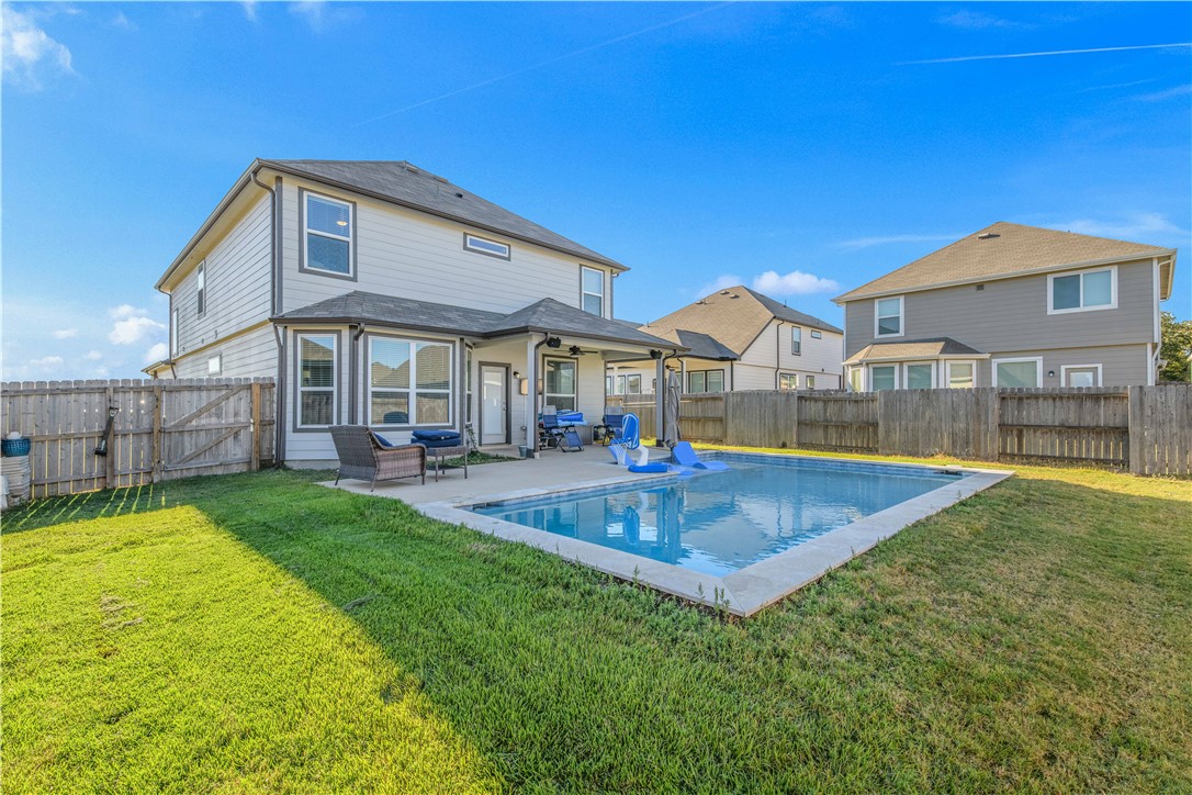 a view of a house with swimming pool