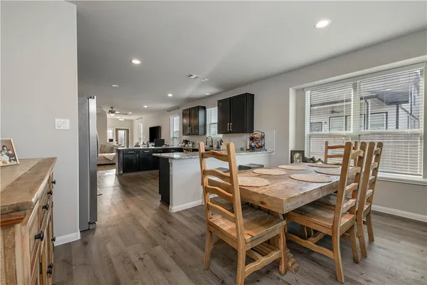 a view of a dining room with furniture and a livingroom