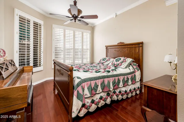 a bedroom with a bed and a table with chair