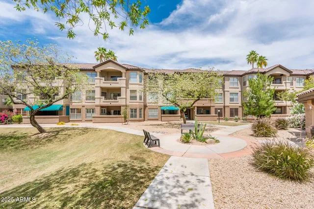 a view of a house with swimming pool and sitting area