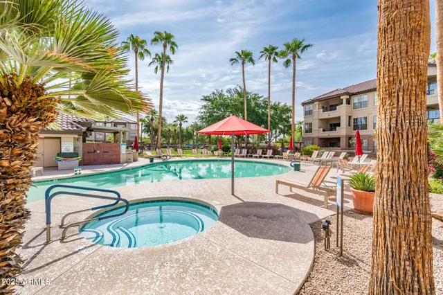 a swimming pool with outdoor seating yard and patio