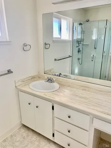 a bathroom with a sink and a mirror