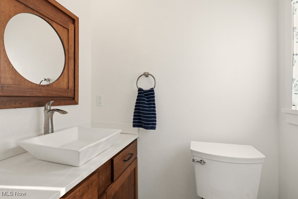 1430 Magnolia Road Southwest Dellroy, OH 44620 - Photo 29 of 50 Stylish and updated half bath with modern vanity and clean design.