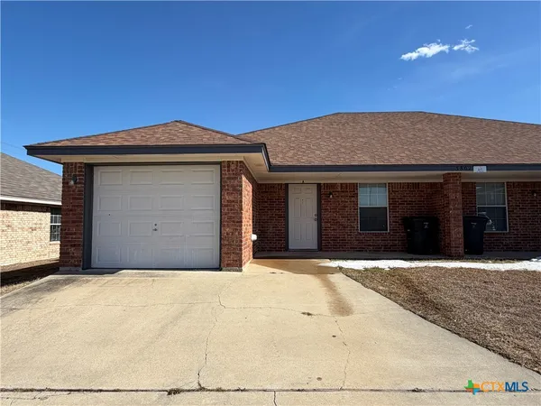 a front view of a house with a garage
