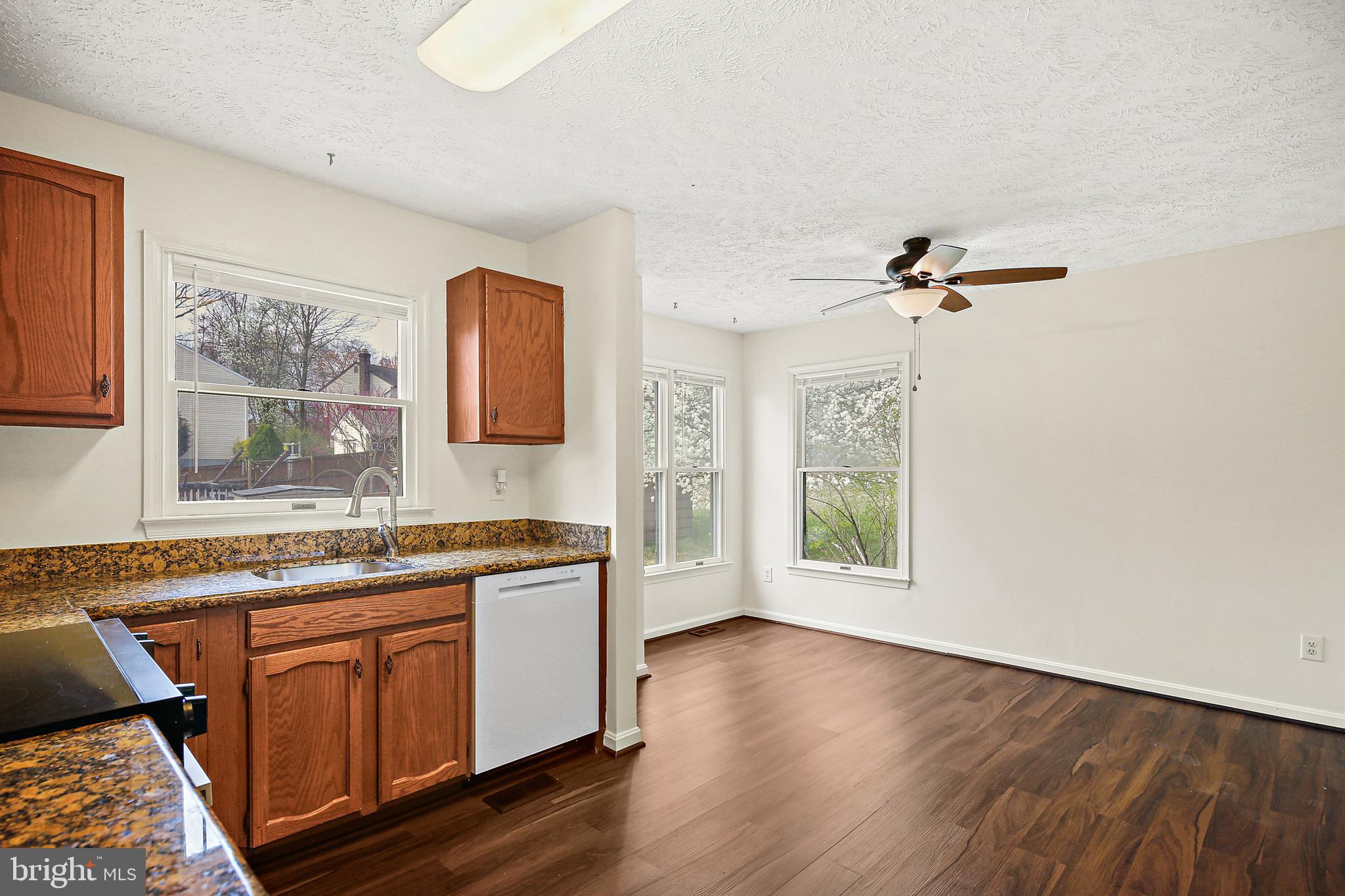 3 Greenknoll Boulevard Hanover, MD 21076 - Photo 11 of 34 a kitchen with a stove a sink and wooden floor