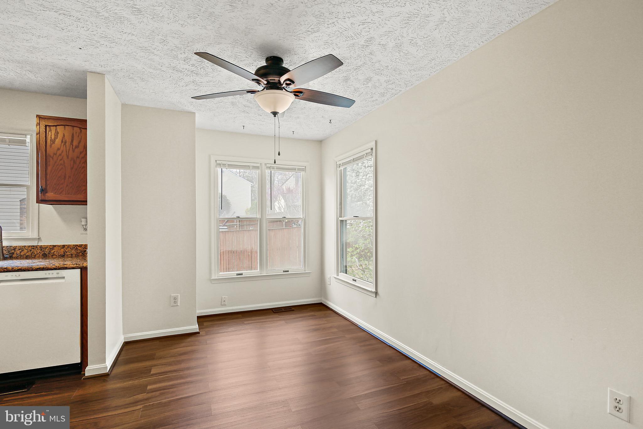 3 Greenknoll Boulevard Hanover, MD 21076 - Photo 15 of 34 a view of an empty room with wooden floor and a window