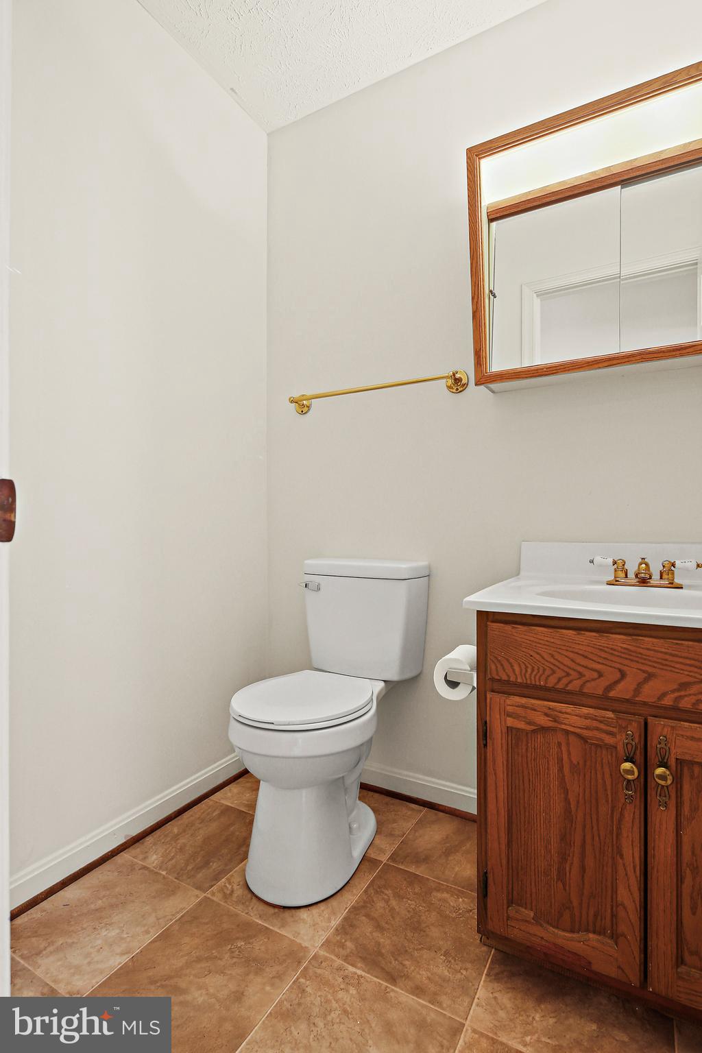 3 Greenknoll Boulevard Hanover, MD 21076 - Photo 17 of 34 a bathroom with a toilet and a sink