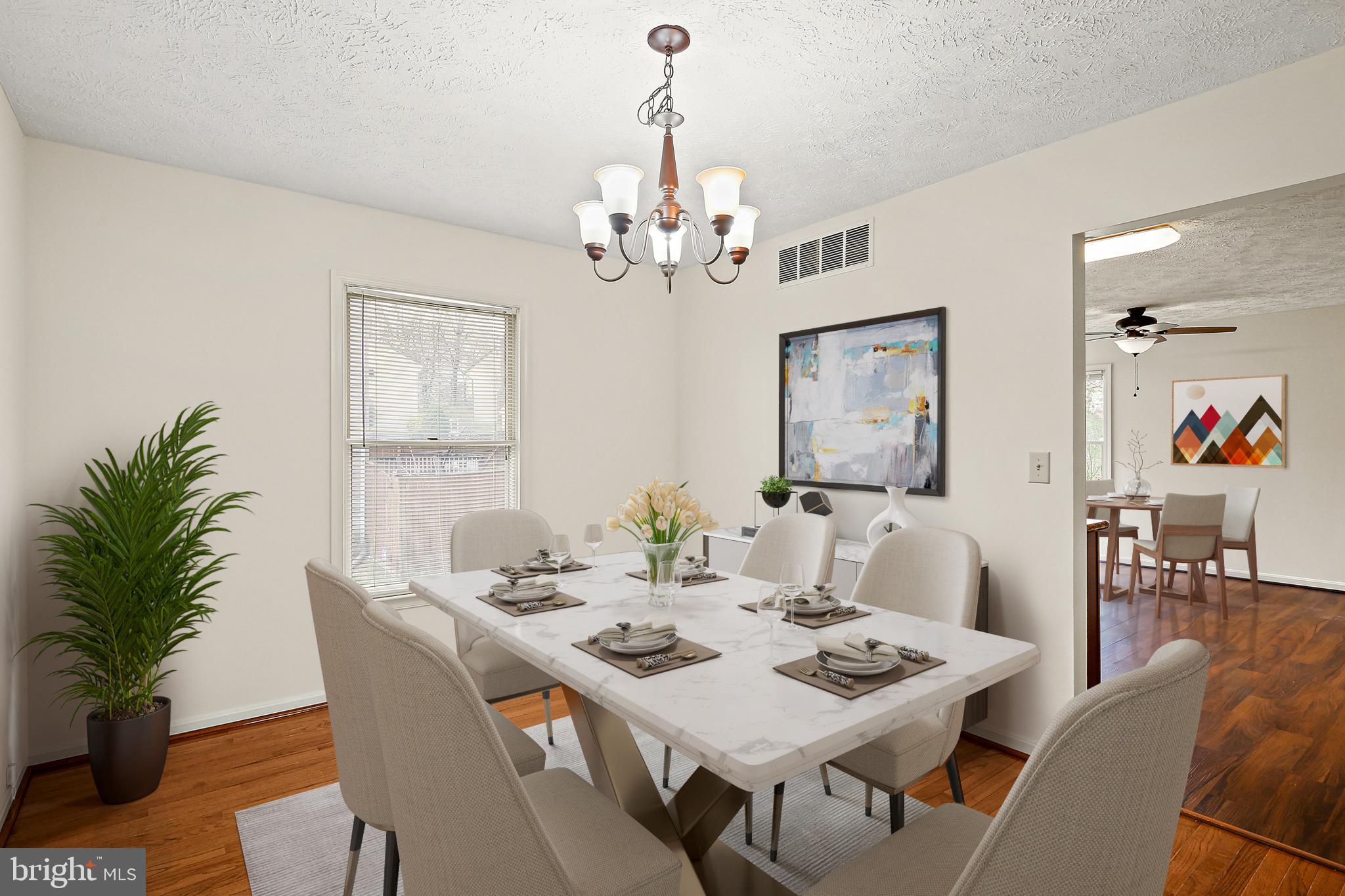 3 Greenknoll Boulevard Hanover, MD 21076 - Photo 7 of 34 a view of a dining room with furniture window and wooden floor