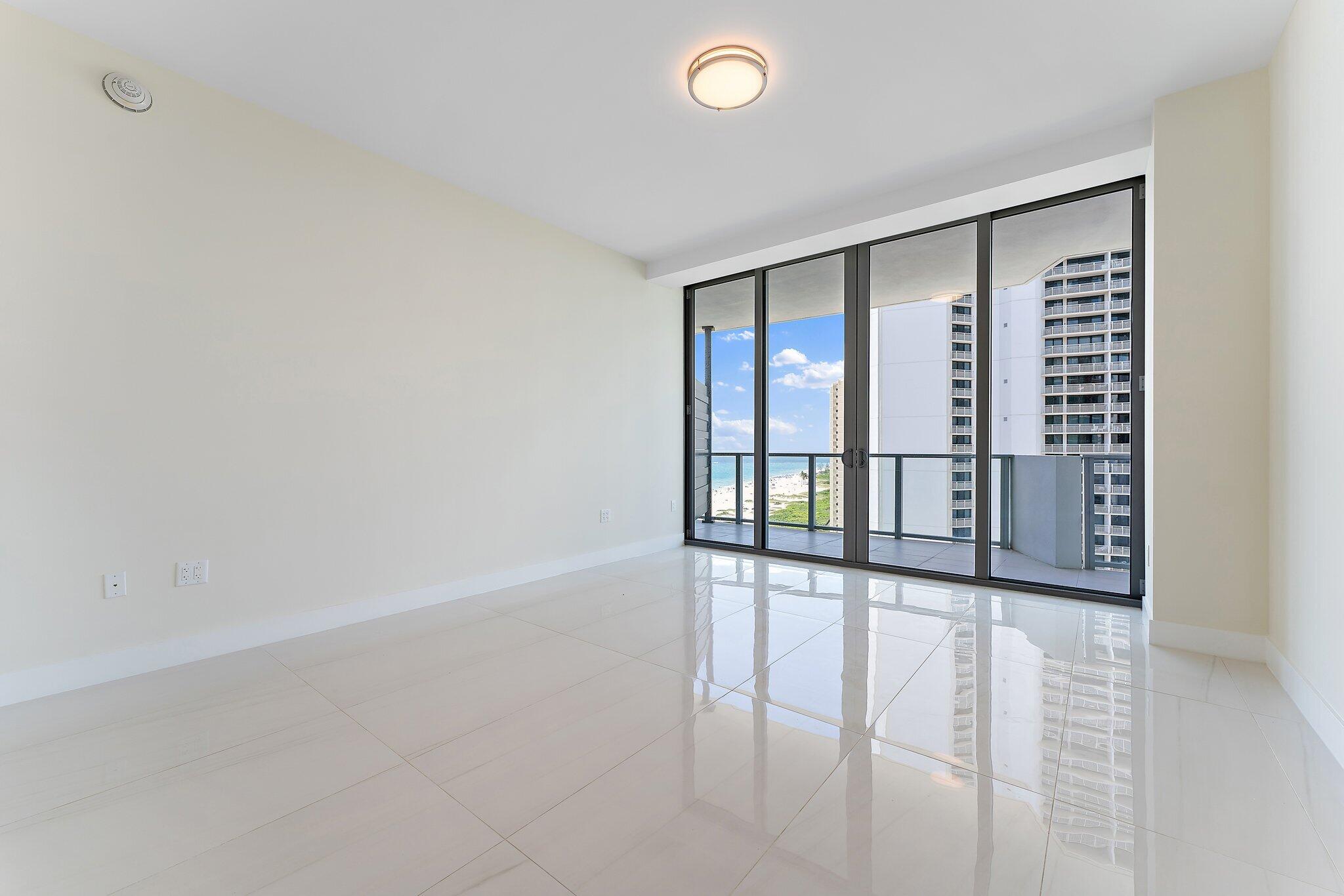 3100 North Ocean Drive, Unit H1206 Singer Island, FL 33404 - Photo 16 of 78 wooden floor in an empty room with a window