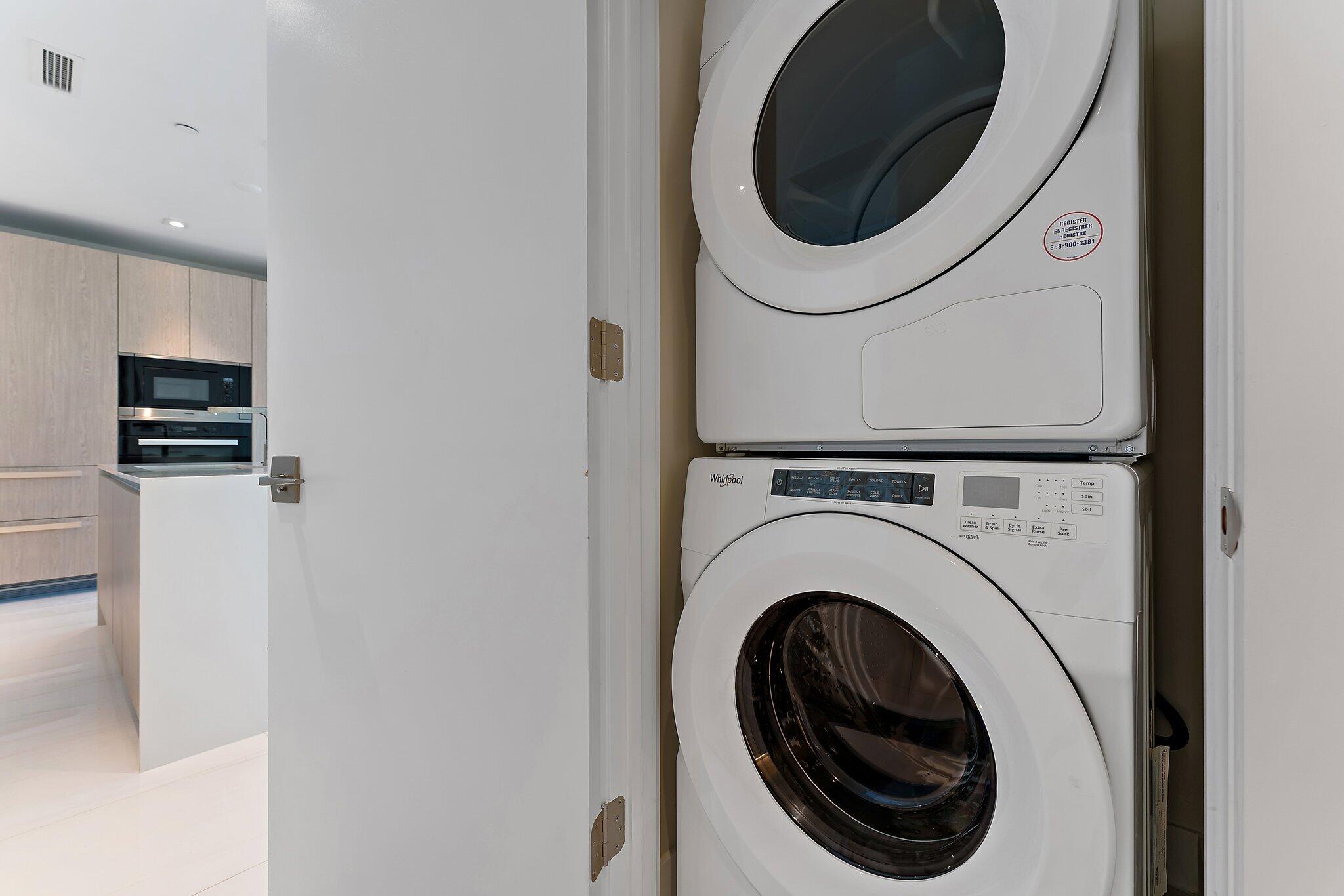 3100 North Ocean Drive, Unit H1206 Singer Island, FL 33404 - Photo 24 of 78 a utility room with dryer and washer