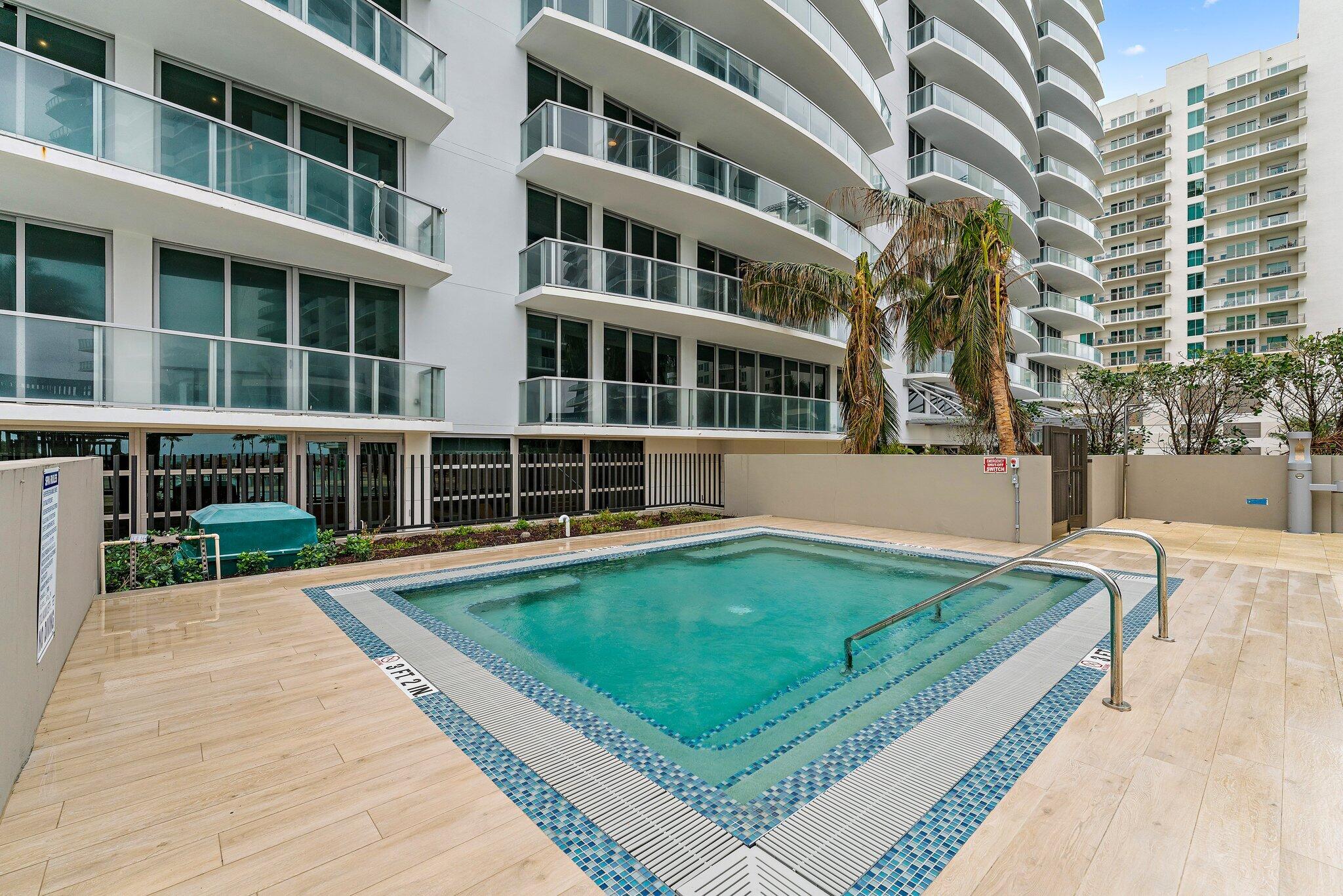 3100 North Ocean Drive, Unit H1206 Singer Island, FL 33404 - Photo 49 of 78 a view of a building with a swimming pool