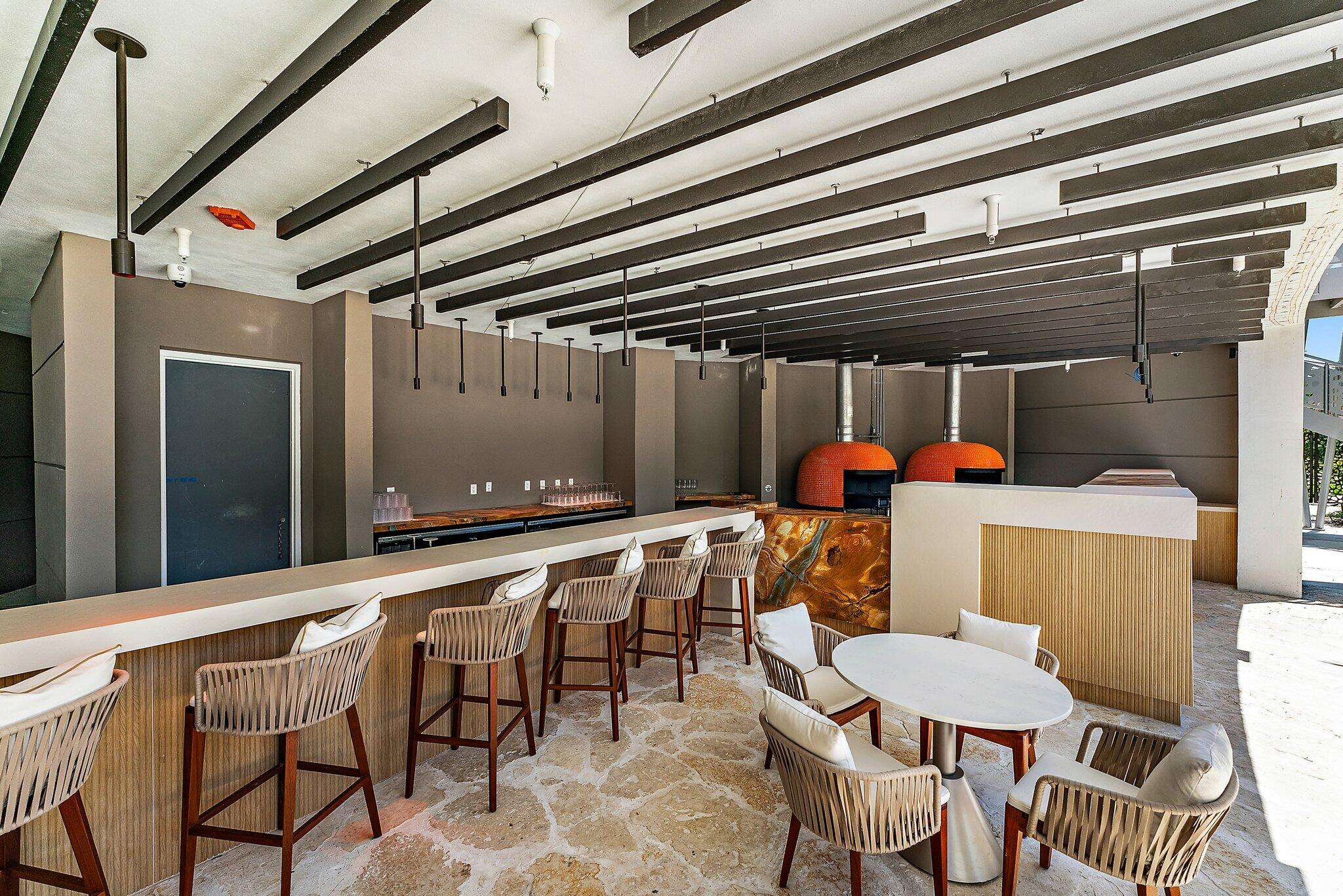 3100 North Ocean Drive, Unit H1206 Singer Island, FL 33404 - Photo 53 of 78 a patio with a table and chairs