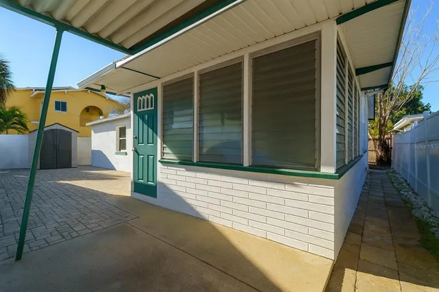 a view of a house with a parking space