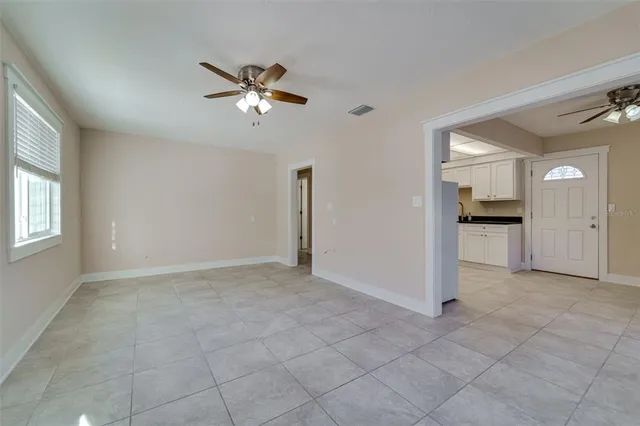 a view of an empty room with a window