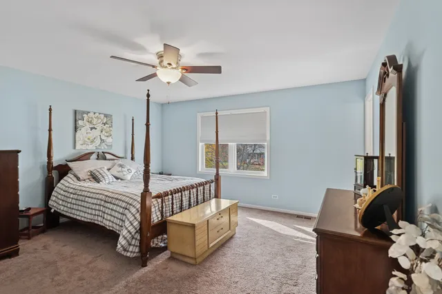 a bed room with a bed furniture and a window