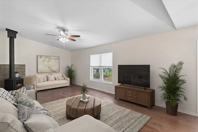 a bedroom with a bed and a large window with the outer view