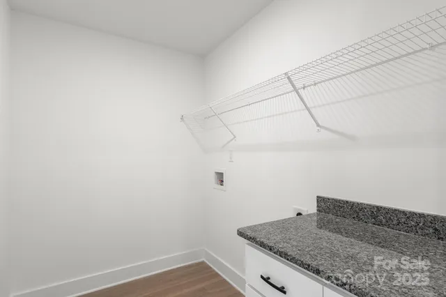 a bathroom with a granite countertop sink and vanity