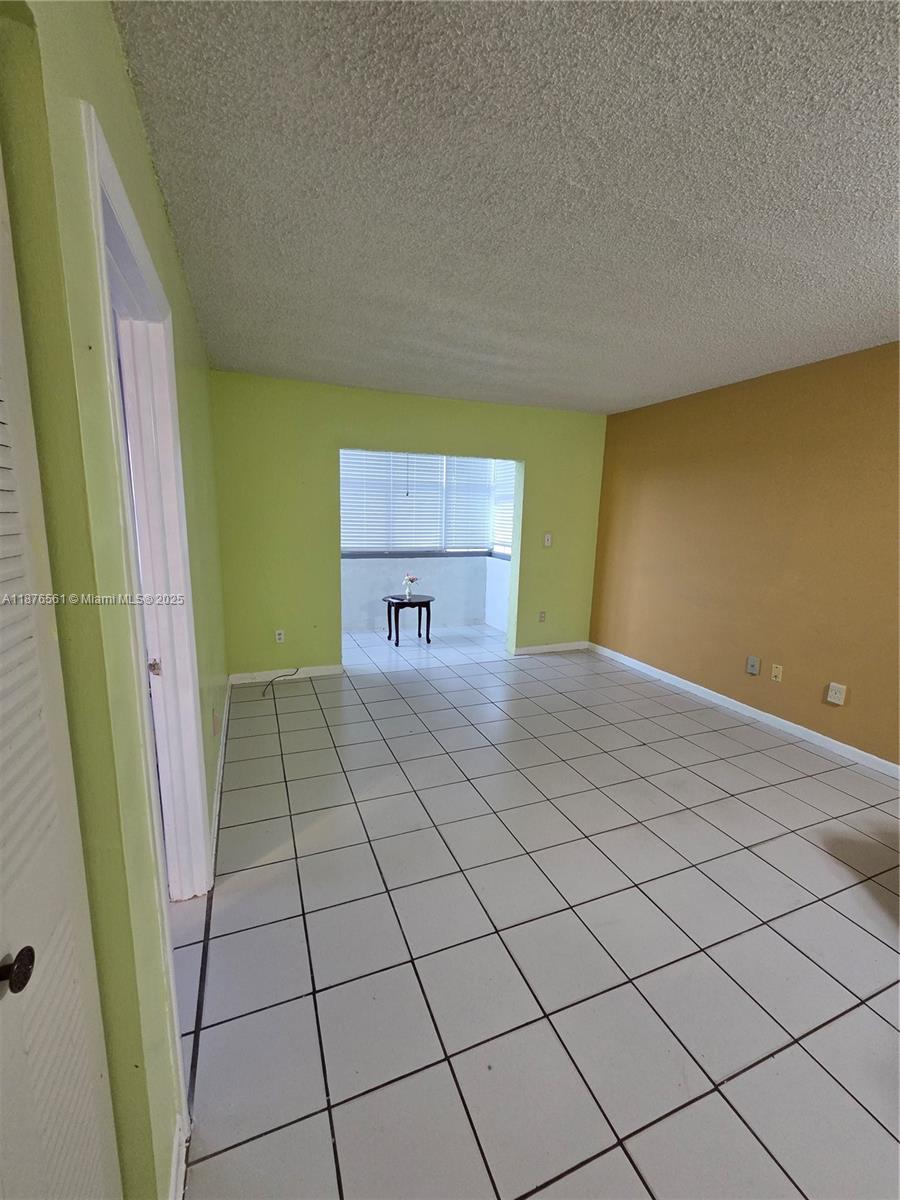 1035 West 77th Street, Unit 305 Hialeah, FL 33014 - Photo 9 of 16 a view of a room with a window