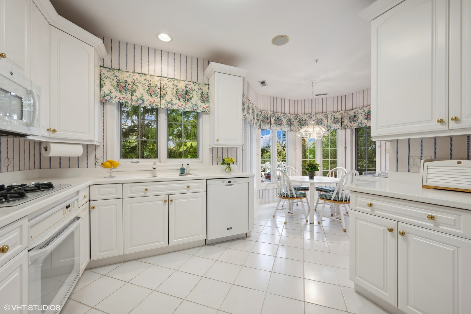 223 Regent Wood Road Northfield, IL 60093 - Photo 13 of 21 a kitchen with a sink and chairs