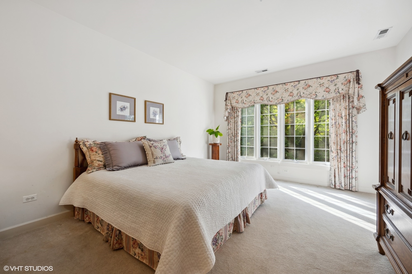 223 Regent Wood Road Northfield, IL 60093 - Photo 16 of 21 a spacious bedroom with a large bed and a large window