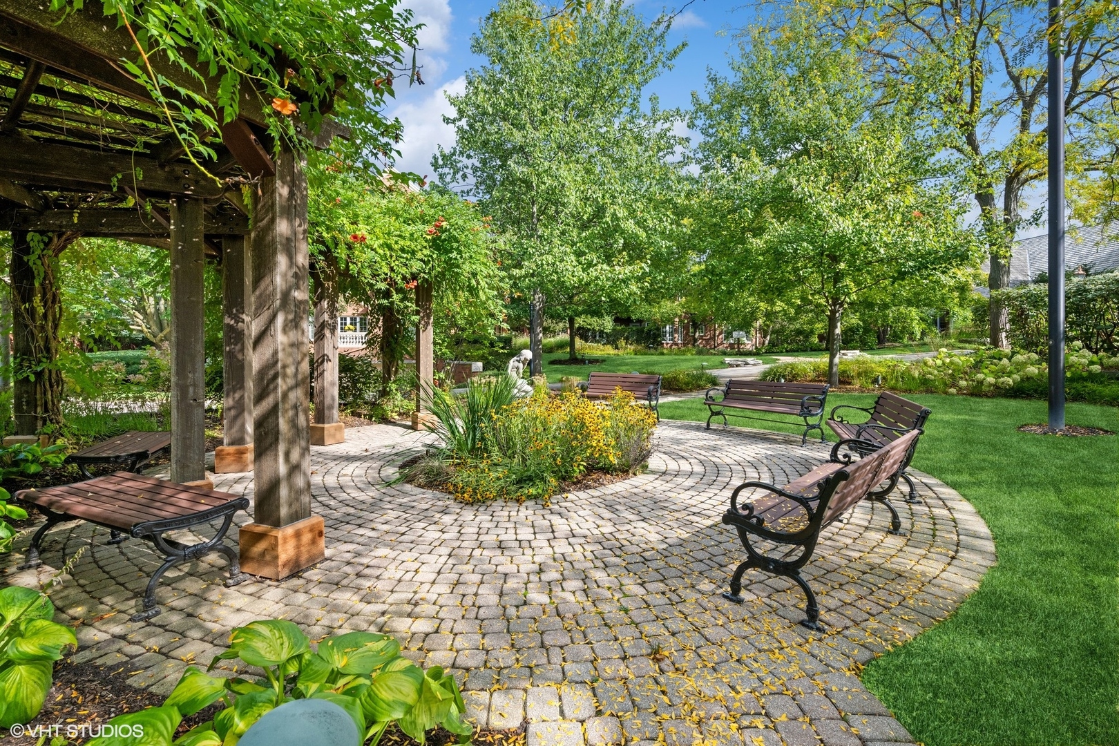 223 Regent Wood Road Northfield, IL 60093 - Photo 18 of 21 a view of a bench in a garden