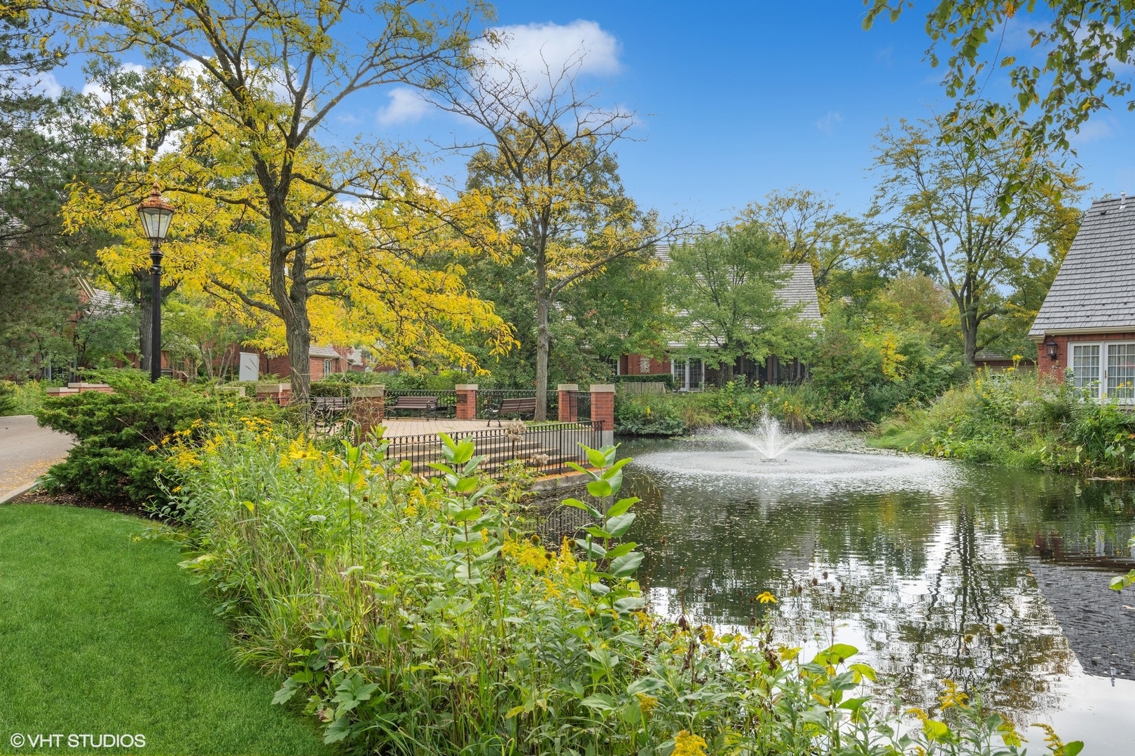 223 Regent Wood Road Northfield, IL 60093 - Photo 19 of 21 a view of a lake in between two large trees